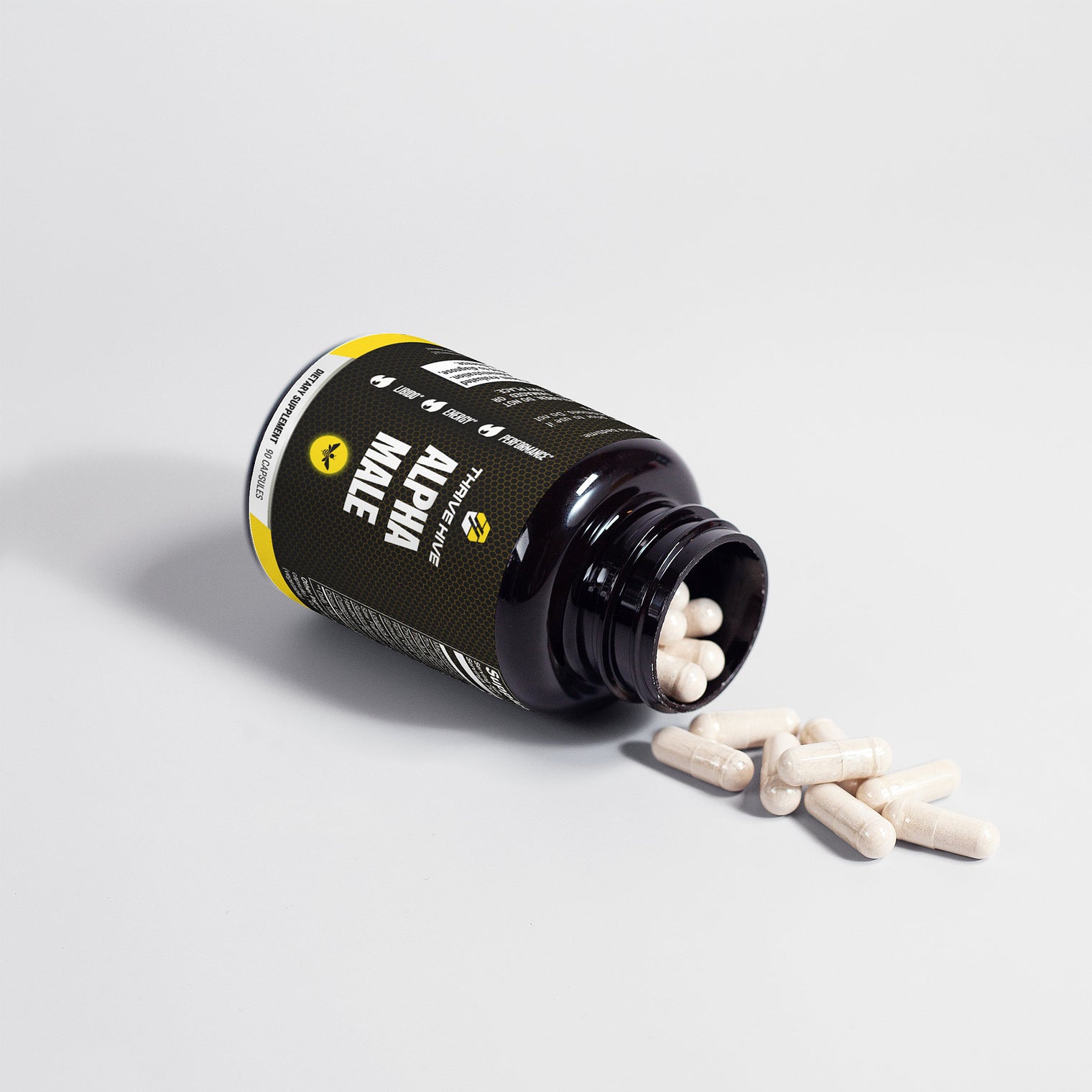 Close-up of a Thrive Hive Alpha Male capsule, a herbal blend for men's health.