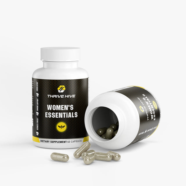 Close-up of a Thrive Hive Women's Essentials capsule, a blend of vitamins and herbs for women's health.