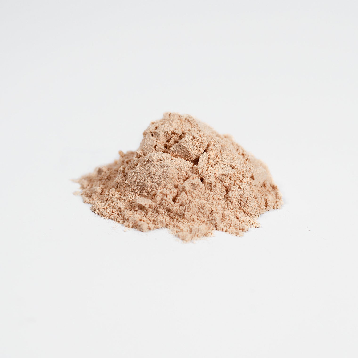 A scoop of Thrive Hive's Fermented Shroom Fusion powder, showing its fine texture for easy mixing.