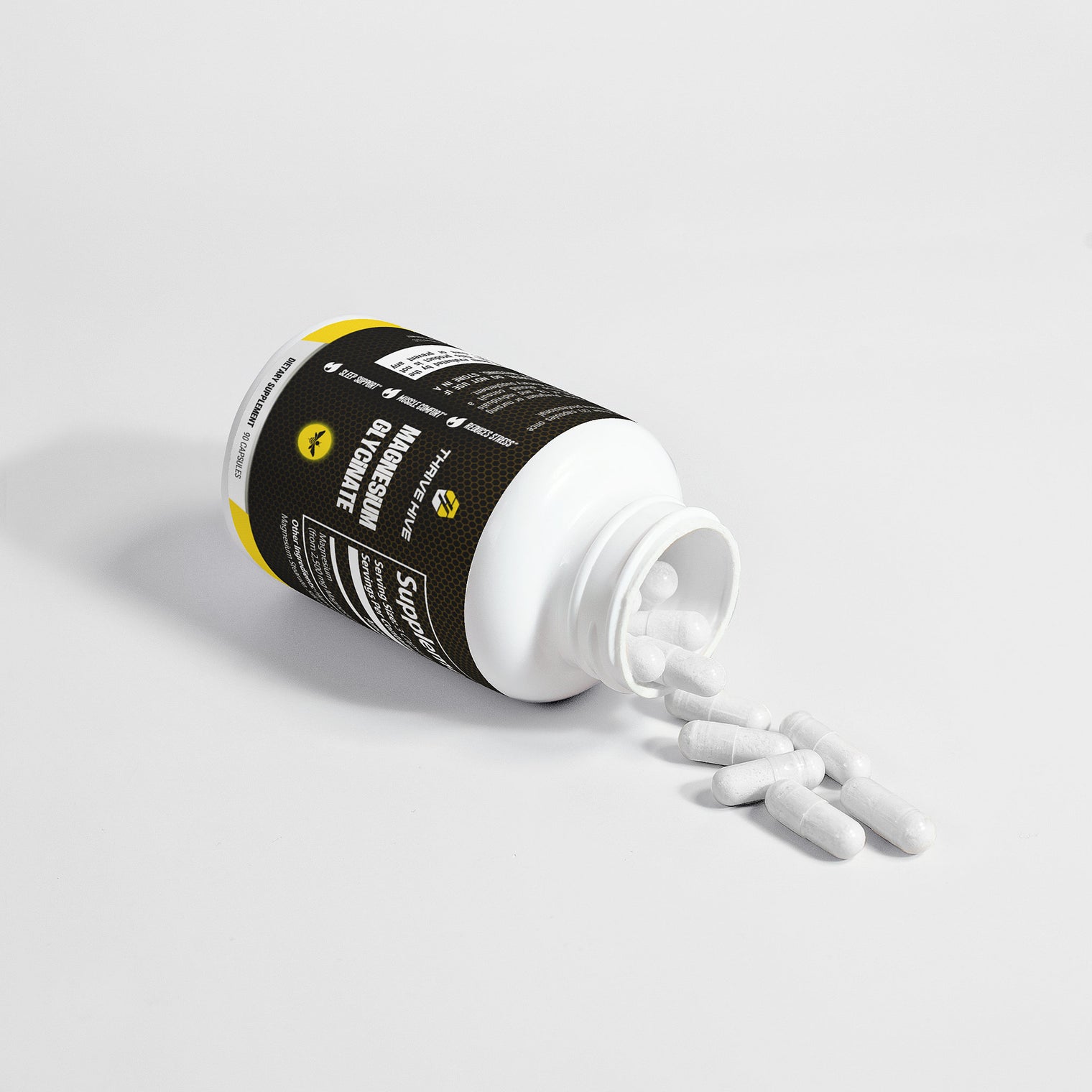 Close-up of a Thrive Hive Magnesium Glycinate capsule, a highly bioavailable supplement.