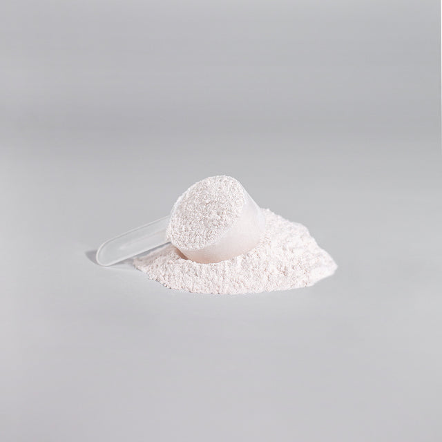 A scoop of Thrive Hive's Fruit Punch Pre-Workout Powder for enhanced endurance.