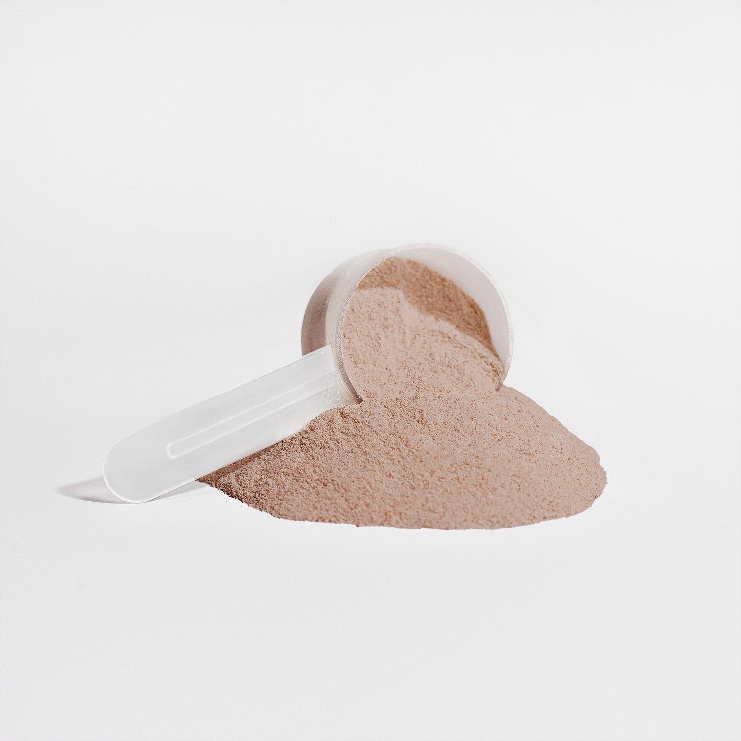 A scoop of Thrive Hive's chocolate plant protein powder, providing 20g of protein for muscle repair.