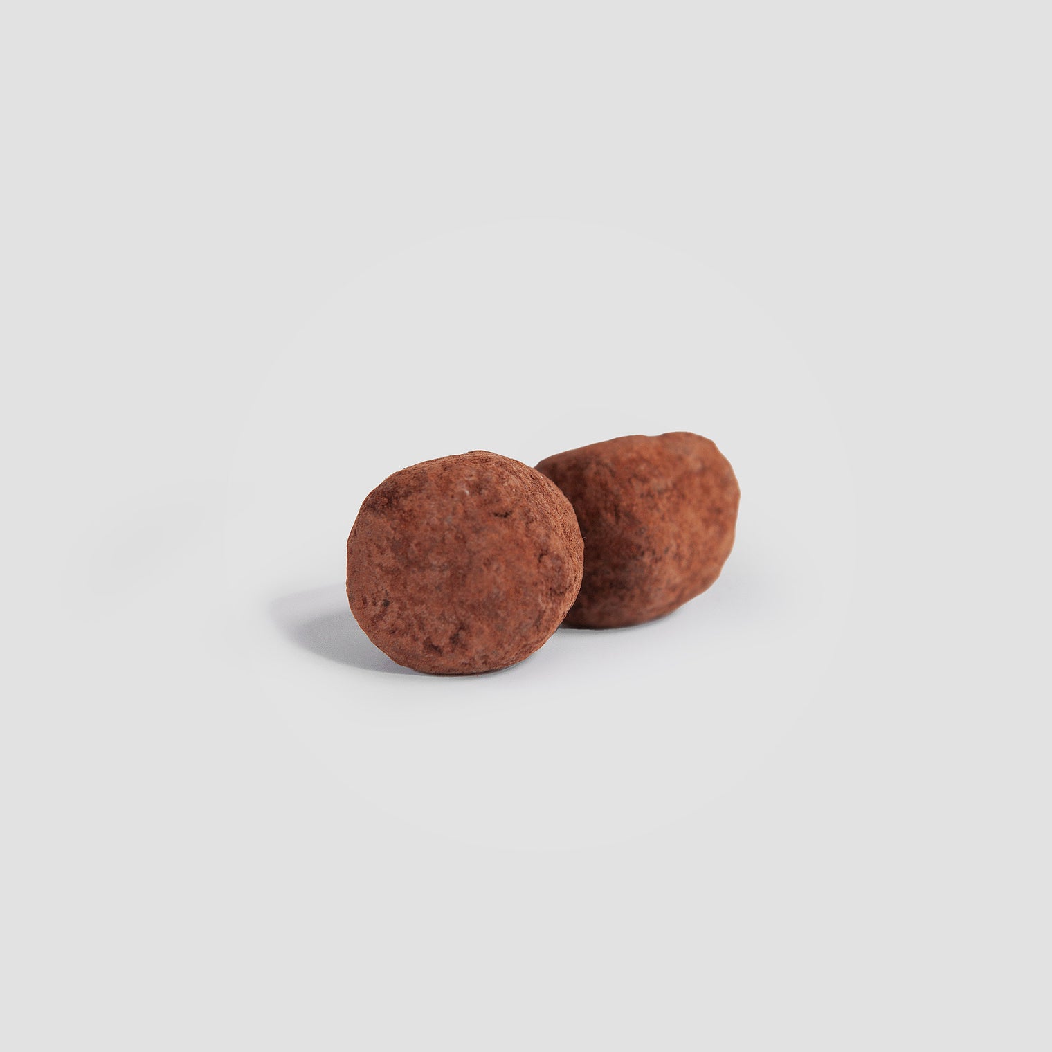 Close-up of a single Thrive Hive Birch Chaga Chocolate Truffle, a delicious way to improve digestion.