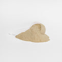 A scoop of Thrive Hive vanilla-flavored Whey Protein Isolate powder, showing its fine texture.