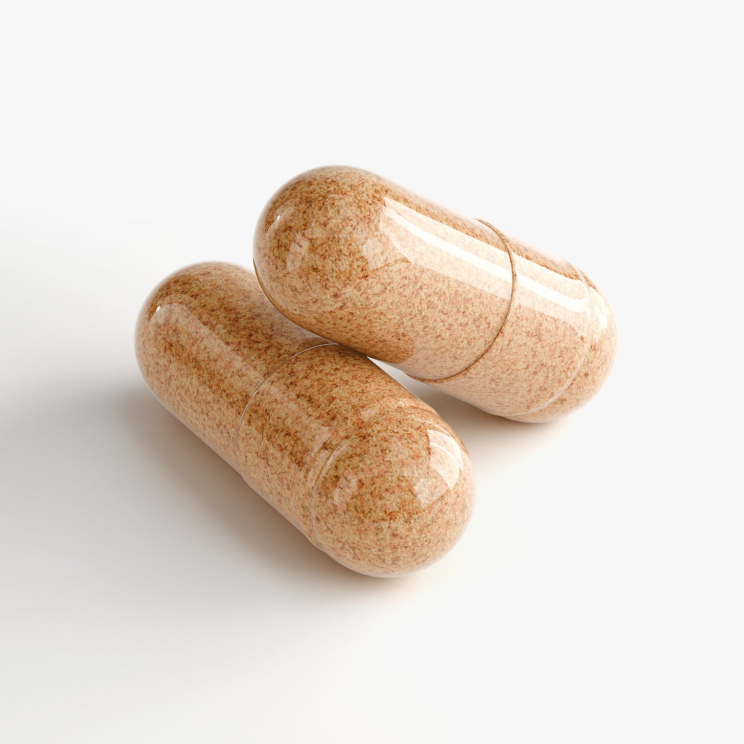 Close-up of a Thrive Hive Bee Bread capsule, a nutrient-rich blend of pollen, nectar, and enzymes.