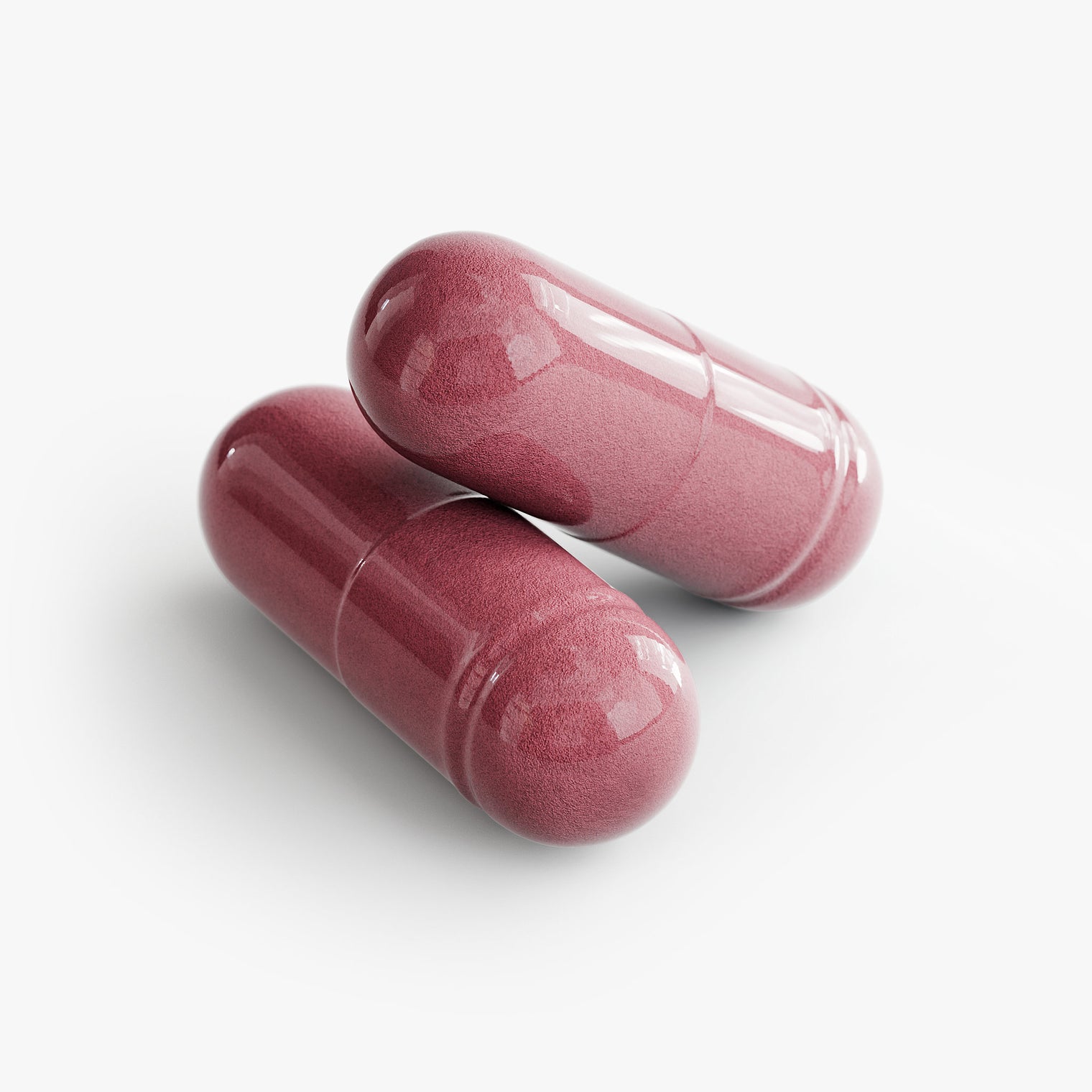 Close-up of a Thrive Hive Beetroot capsule, containing organic beetroot powder for enhanced circulation.
