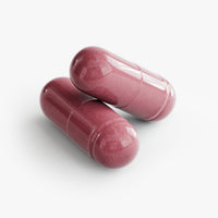 Close-up of a Thrive Hive Beetroot capsule, containing organic beetroot powder for enhanced circulation.