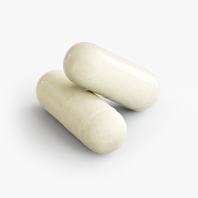 Close-up of a Thrive Hive Digestive Enzyme Advanced Blend capsule, with a comprehensive formula for gut health.