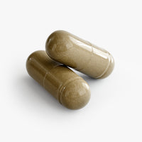 Close-up of a Thrive Hive Ginkgo Biloba and Ginseng capsule, a natural herbal blend for cognitive support.