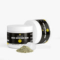 A scoop of vibrant green powder from Thrive Hive's plant-based superfood blend.
