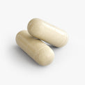 Close-up of a Thrive Hive Gut Check capsule, a comprehensive formula for a balanced gut.