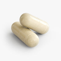 Close-up of a Thrive Hive Gut Check capsule, a comprehensive formula for a balanced gut.