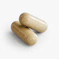 Close-up of a Thrive Hive Hair, Skin and Nails Formula capsule, a comprehensive blend of vitamins and minerals.