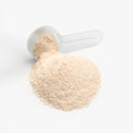 A scoop of Thrive Hive's electrolyte powder, providing essential nutrients for athletes and professionals.