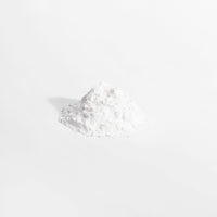 A scoop of white L-Glutamine powder from Thrive Hive's unflavored supplement.