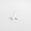 Close-up of a Thrive Hive Magnesium Glycinate capsule, a highly bioavailable supplement.