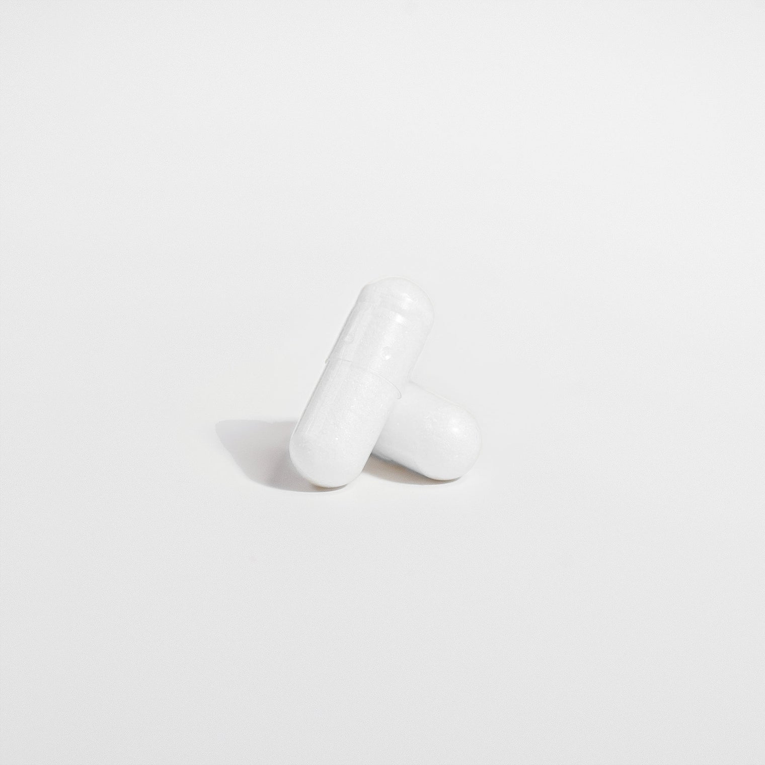 Close-up of a Thrive Hive Magnesium Glycinate capsule, a highly bioavailable supplement.