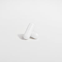 Close-up of a Thrive Hive Magnesium Glycinate capsule, a highly bioavailable supplement.